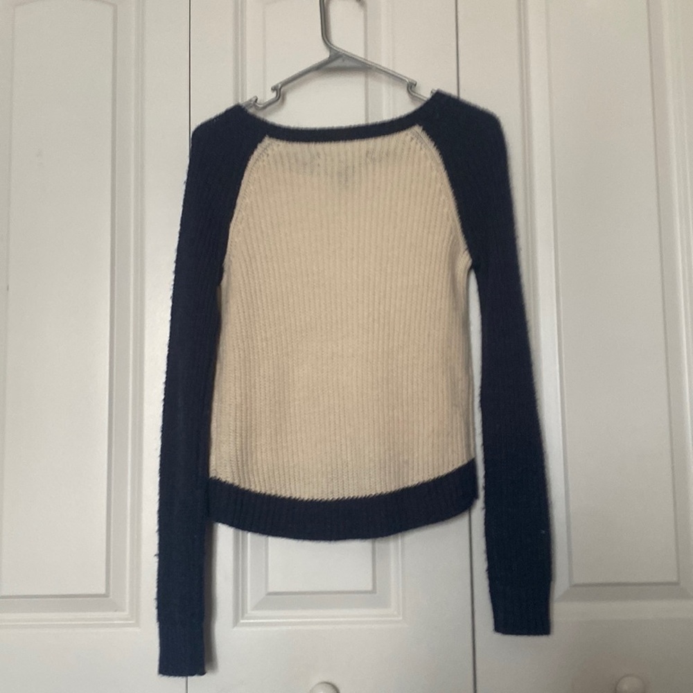 cream and blue sweater